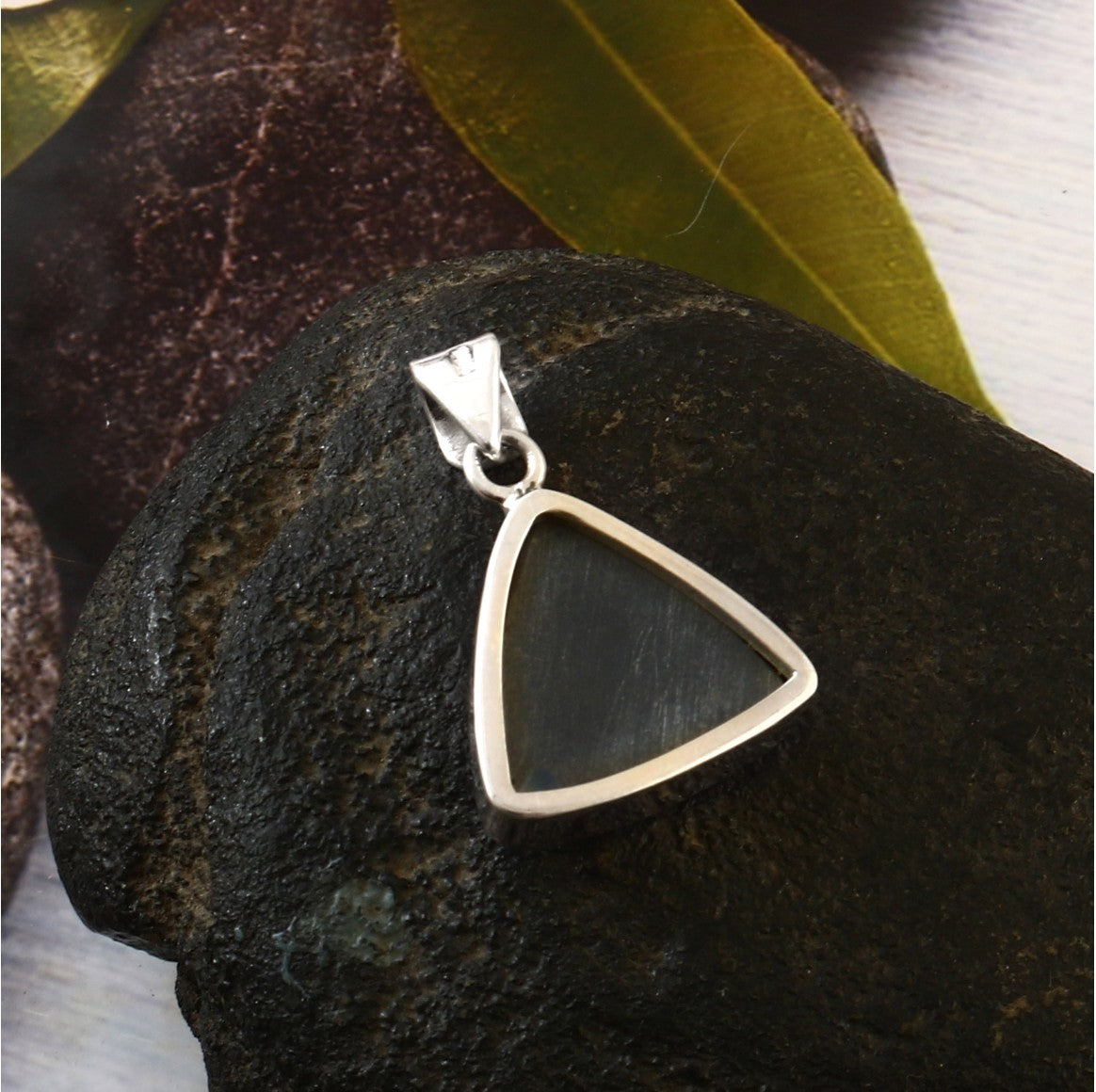 Triangular silver pendant 